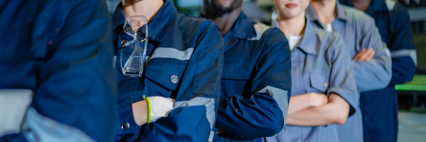 workers reviewing assessment on forced labor